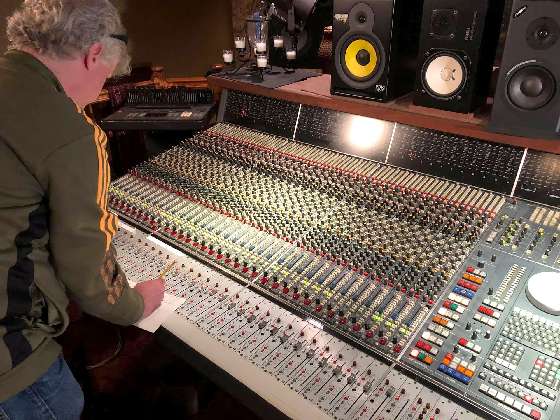 Audio engineer working at the large-format analog console at City Lights Recording Studio